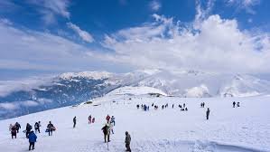 Snow-covered Apharwat Peak under clear skies, viewed from the top gondola station in Gulmarg